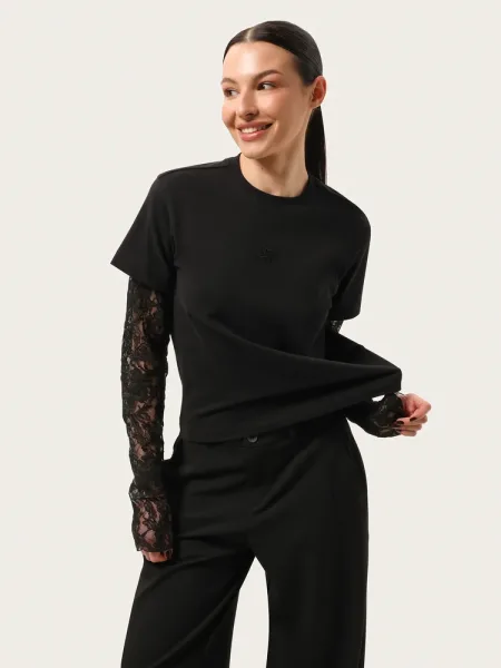 Top noir à manches longues avec manches en dentelle et broderie