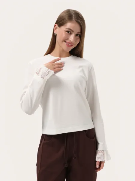Top manches longues minimaliste couleur ivoire avec dentelle sur les manches