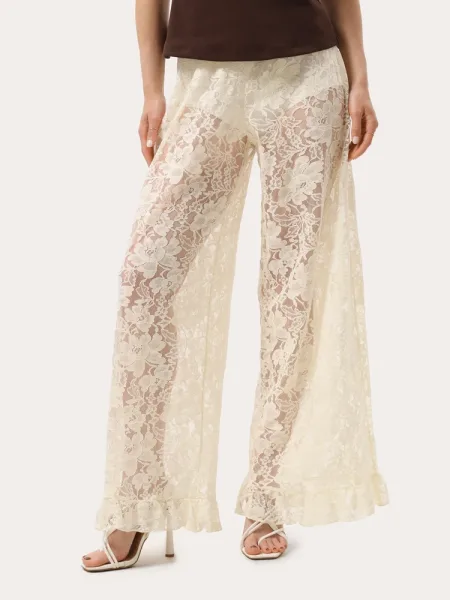 Pantalon écru en dentelle à volants